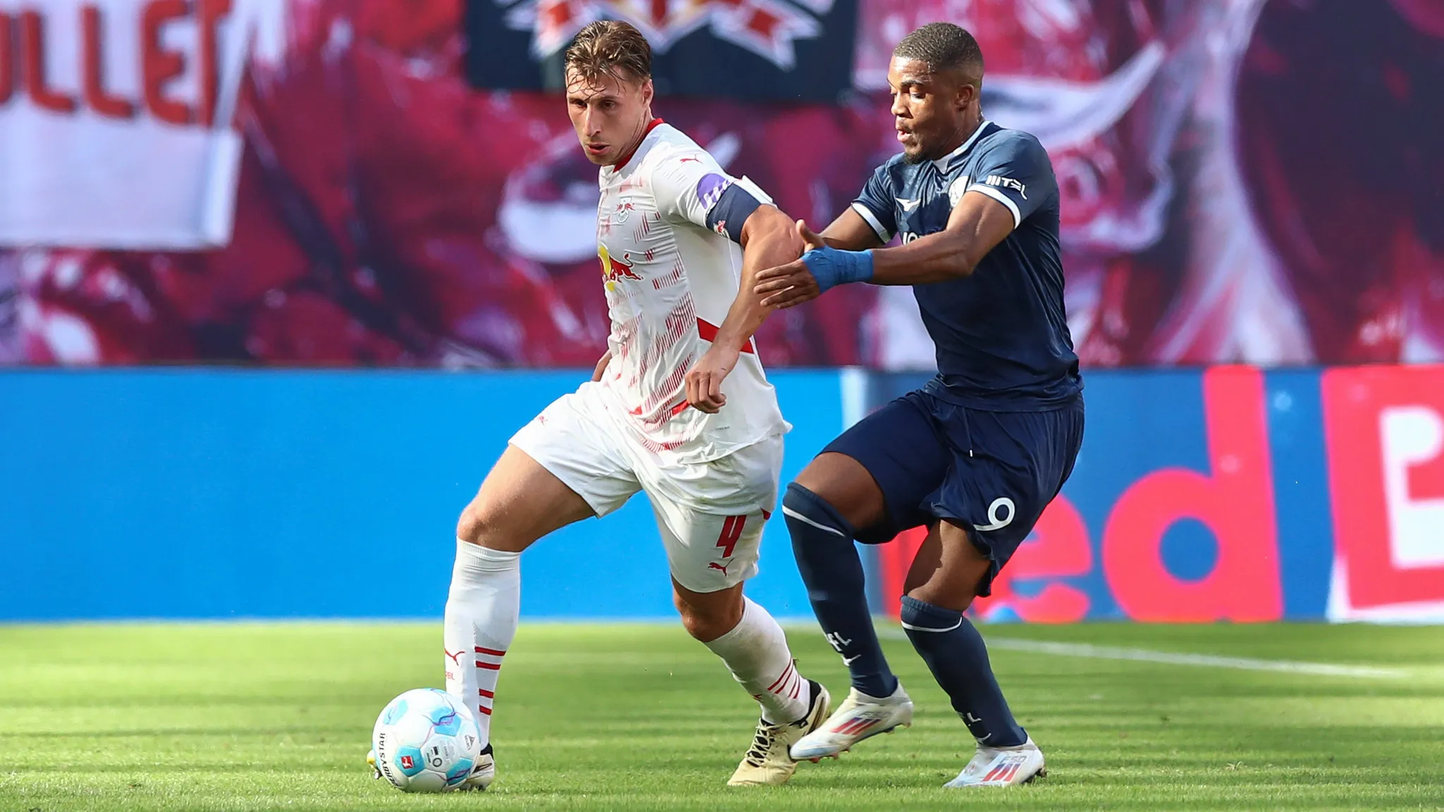 Willi Orban fighting for possession against Bochum player Myron Boadu.