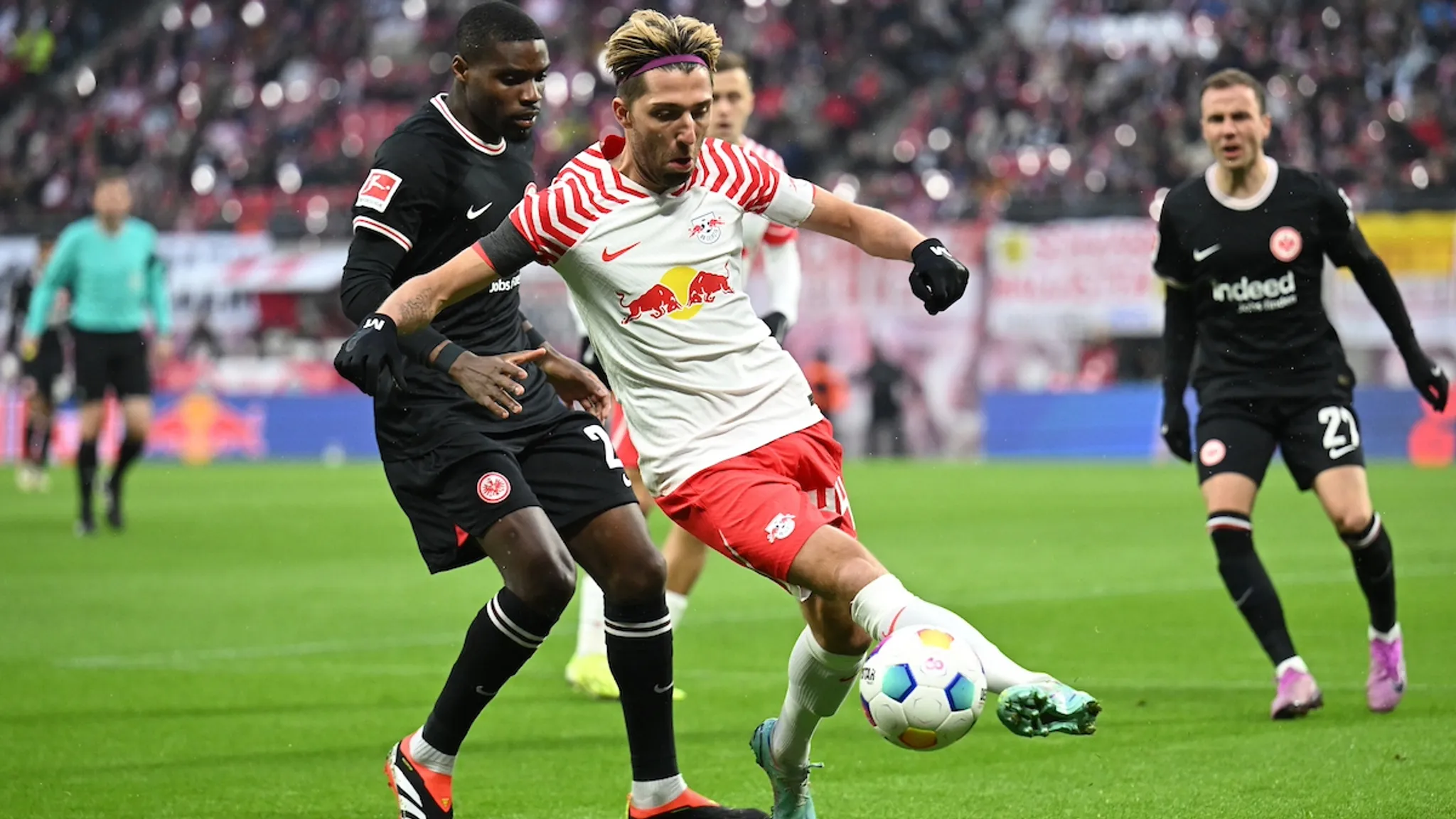 RBL's captain Kevin Kampl shields the ball from Niels Nkounkou.