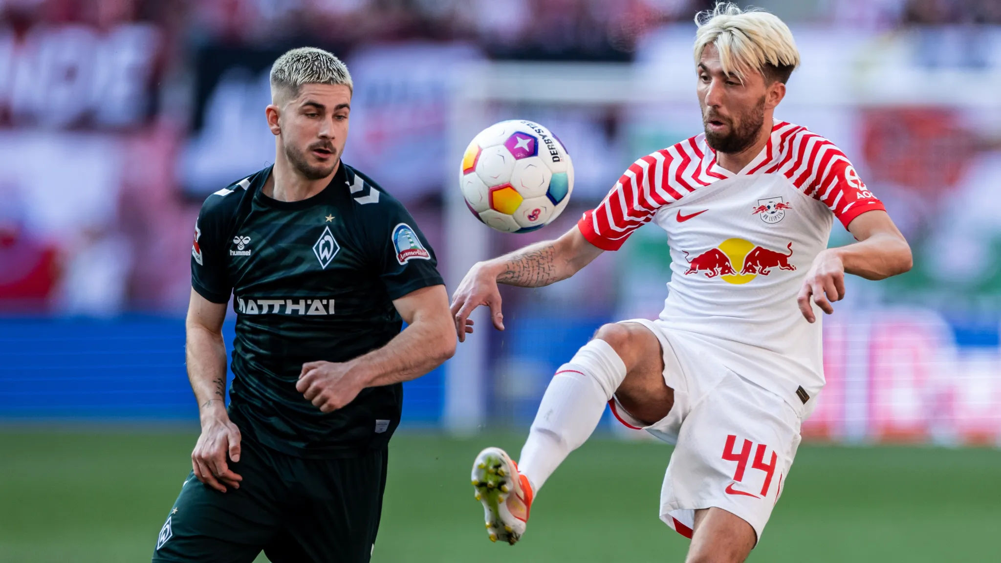 Bremen's Romano Schmid and Kevin Kampl fighting for the ball.