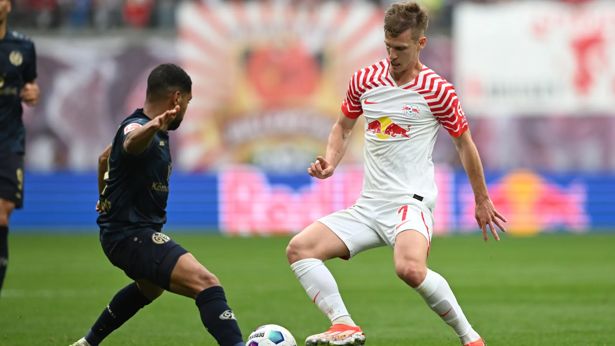 Dani Olmo goes past a Mainz opponent.