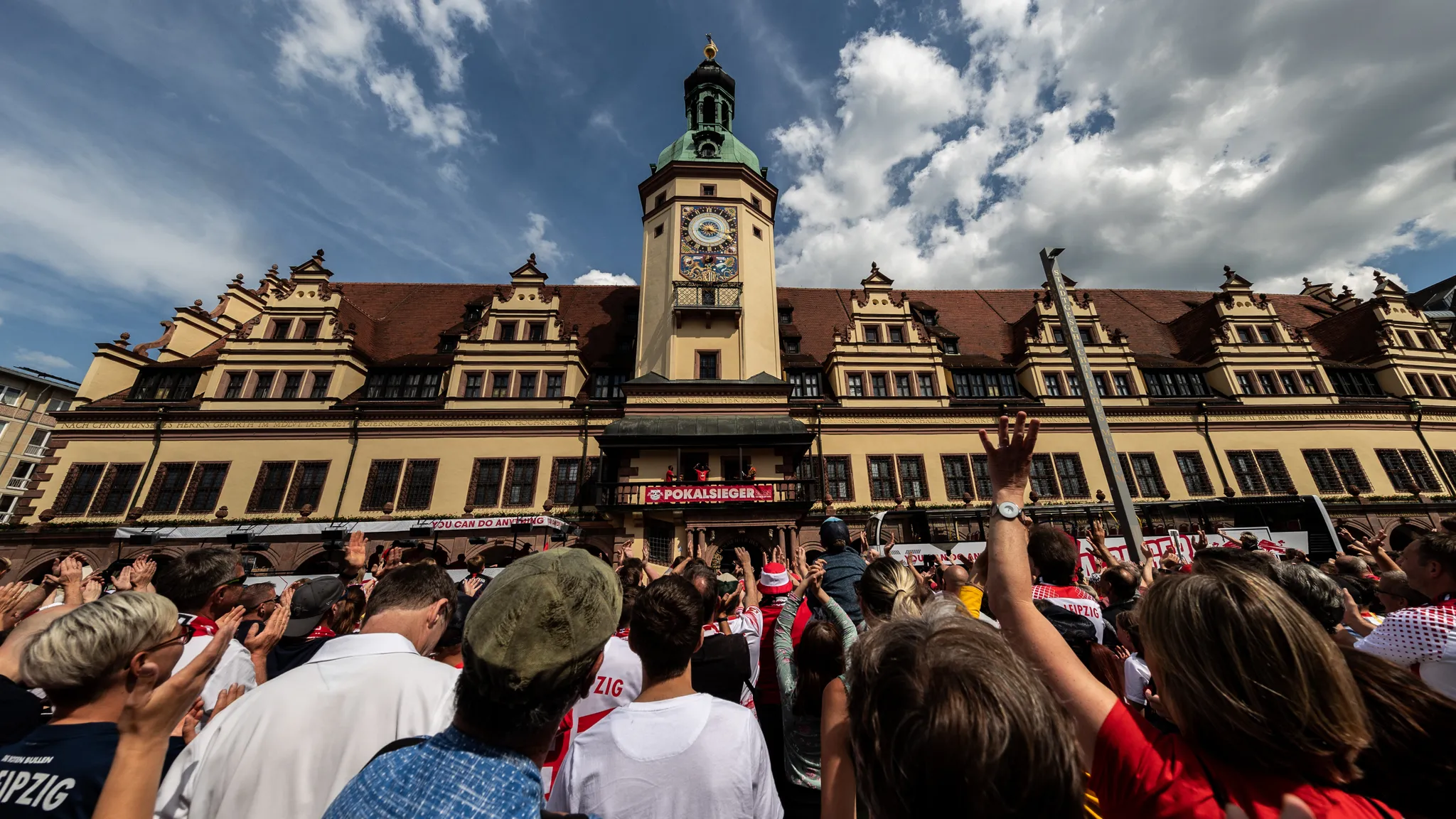 RBL fans celebrating the DFB Pokal win in front of Leipzig's City Hall.