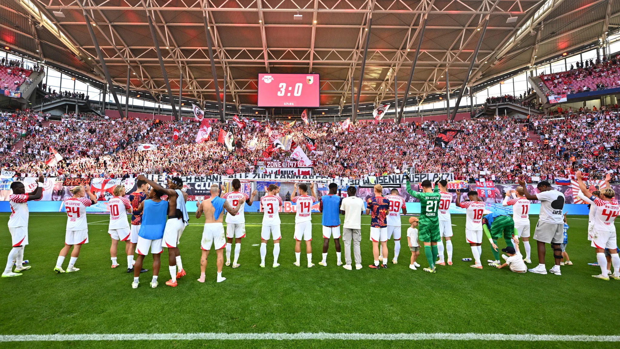The players celebrate the 3-0 win over FC Augsburg.